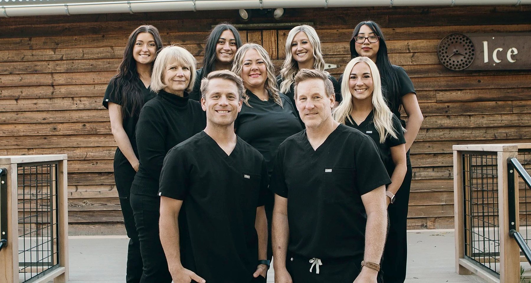The Three Fountains Dentistry team in black scrubs